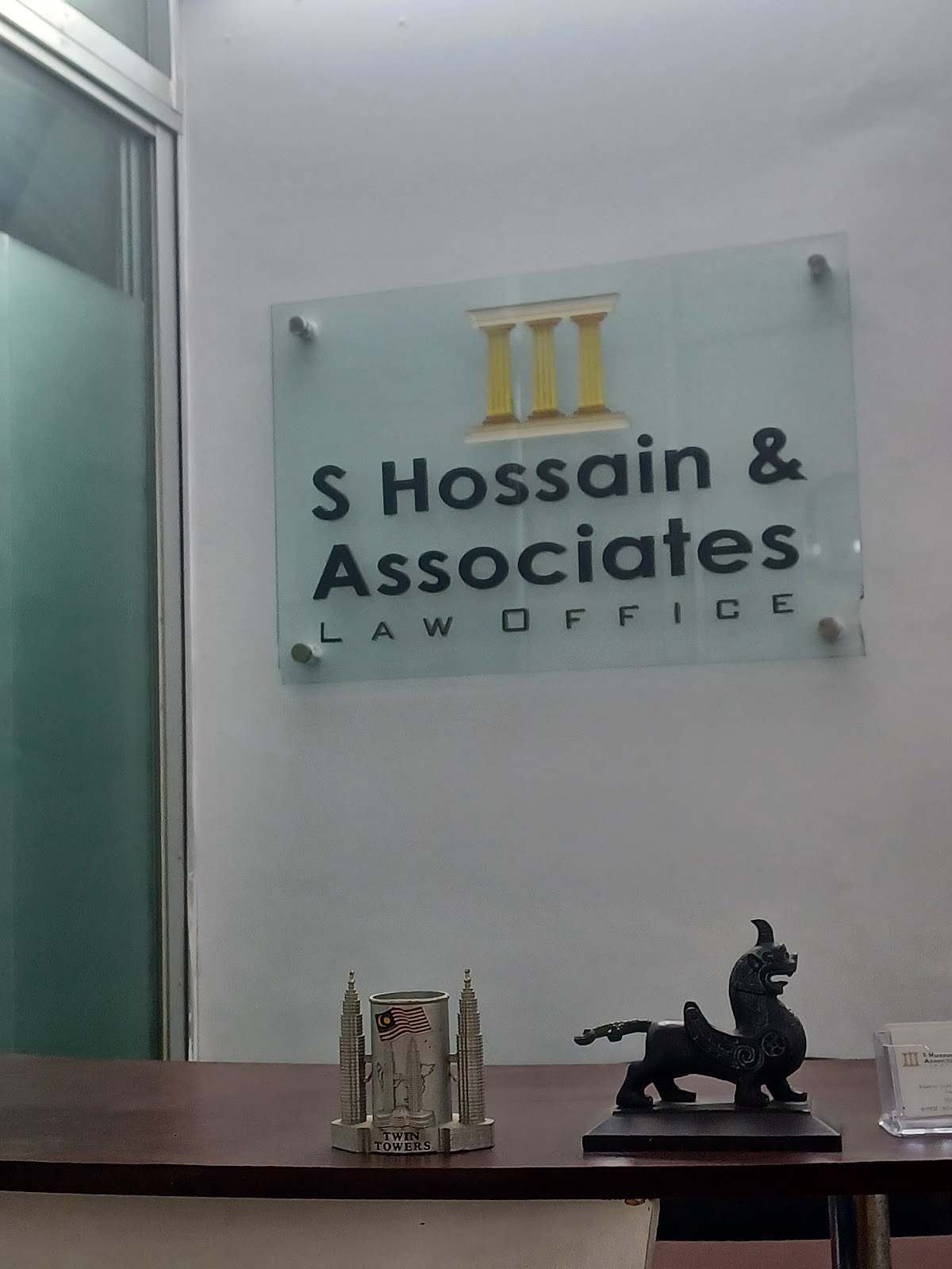 S Hossain & Associates logo